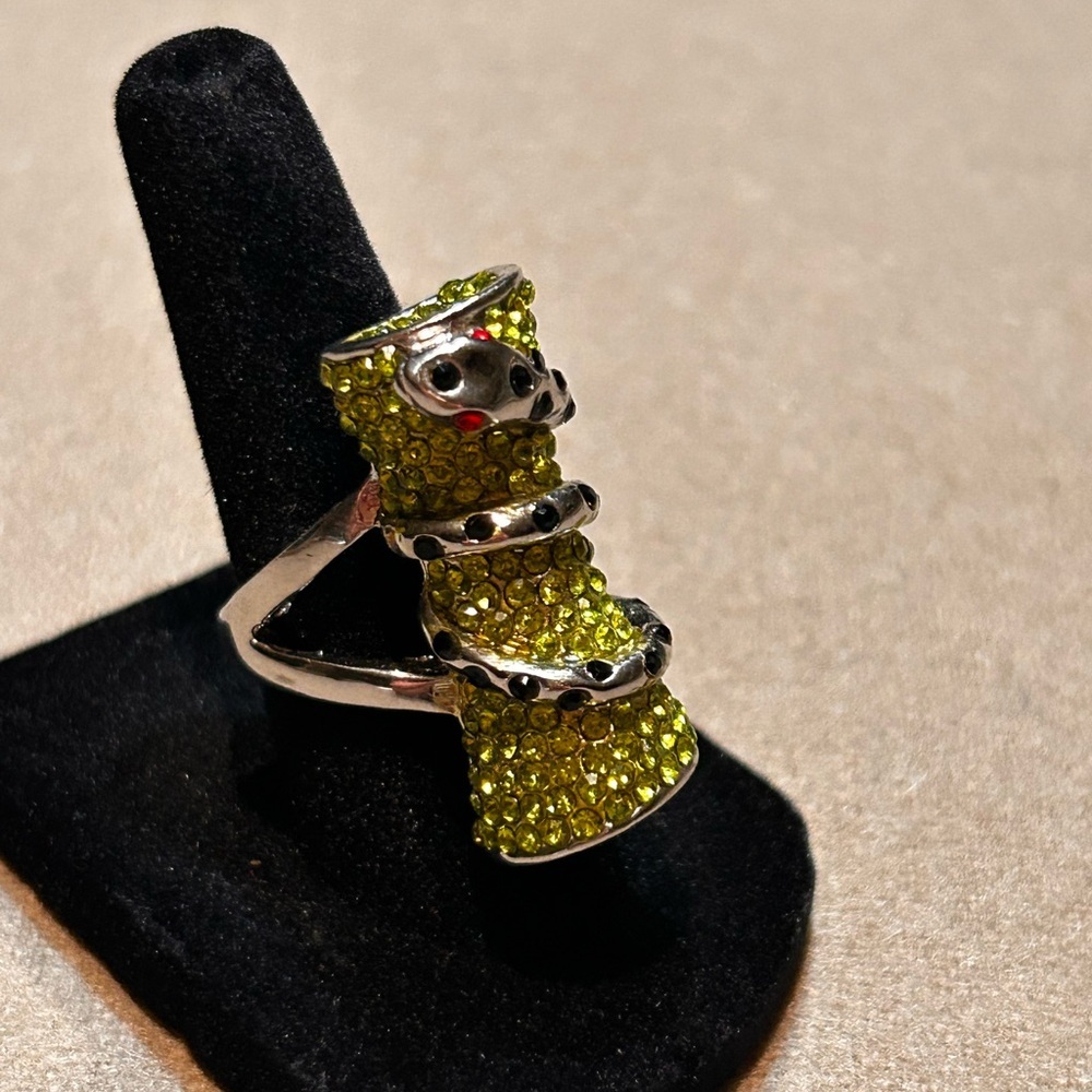 Like New Crystal Snake Ring featuring light green and red crystals. Size 6.5​